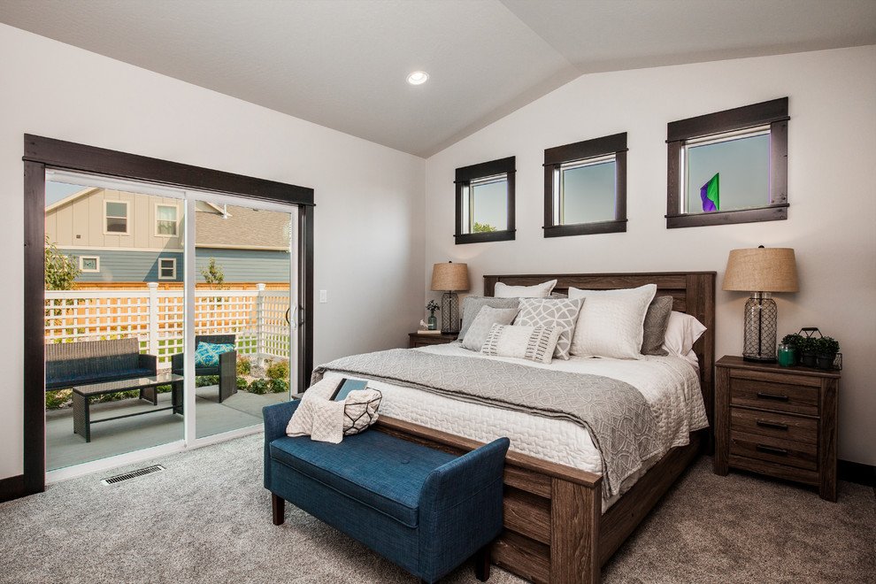 Photo of a large country master bedroom in Other with white walls, carpet and grey floors.