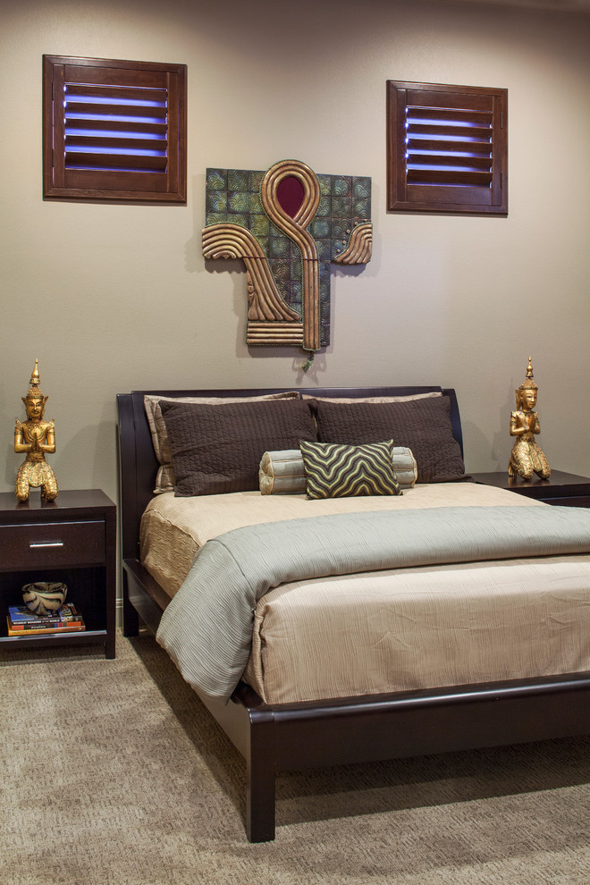 Inspiration for a mid-sized transitional guest carpeted bedroom remodel in Austin with beige walls