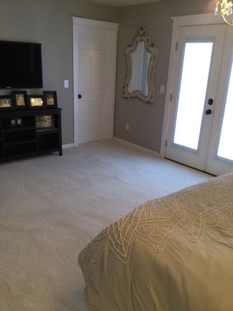 Medium sized classic master bedroom in Other with grey walls and carpet.