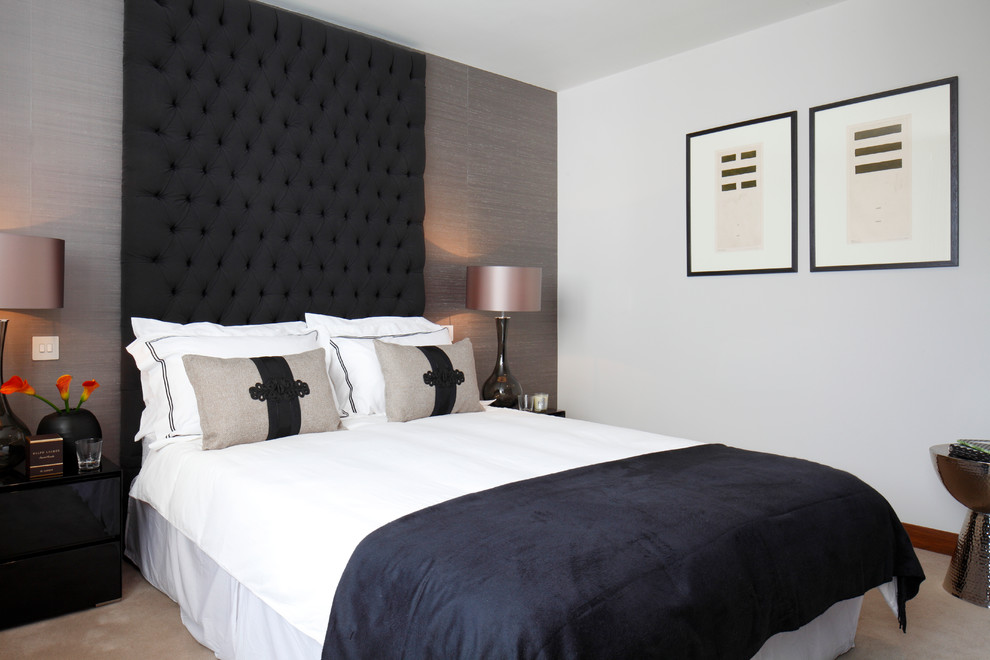 Example of a transitional carpeted bedroom design in London with gray walls