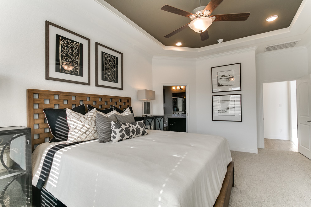 Photo of a modern guest bedroom in Houston with white walls, carpet and beige floors.