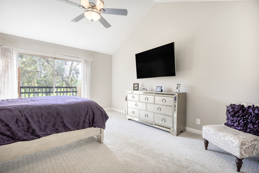 Inspiration for a mid-sized transitional master carpeted bedroom remodel in Orange County with gray walls
