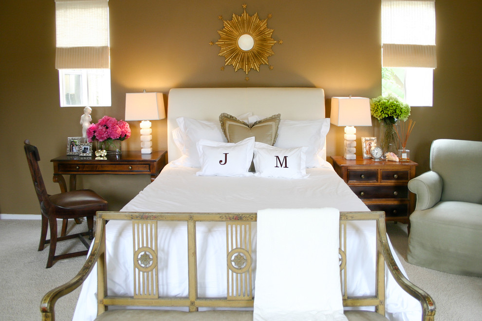 Inspiration for a coastal carpeted bedroom remodel in Orange County with beige walls