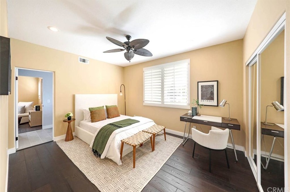 Inspiration for a mid-sized contemporary guest dark wood floor bedroom remodel in Orange County