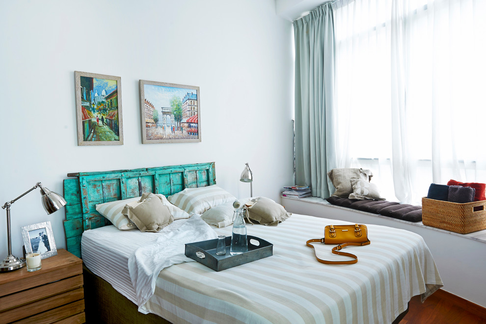 Design ideas for a small eclectic master bedroom in Singapore with white walls.