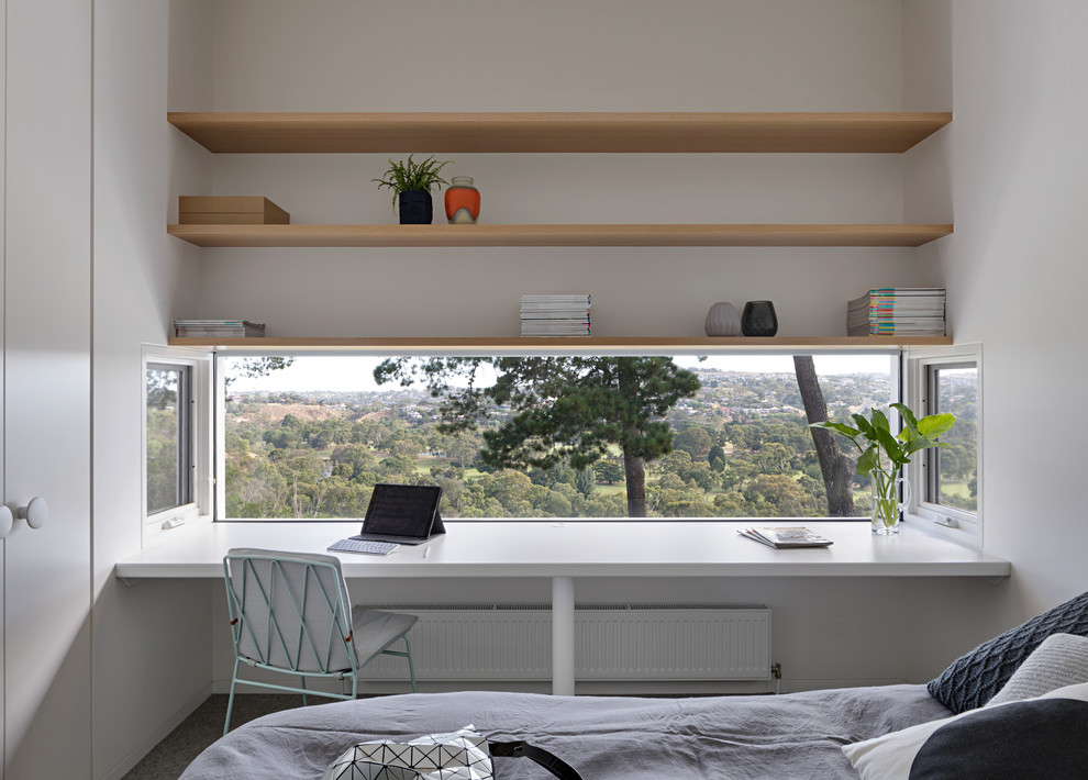 Photo of a modern guest bedroom in Melbourne with white walls.