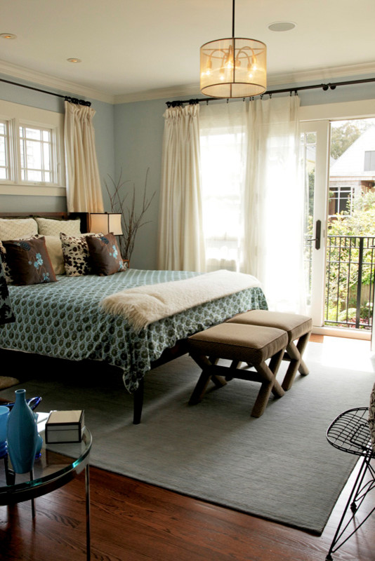 Bedroom - transitional master medium tone wood floor bedroom idea in San Francisco with blue walls