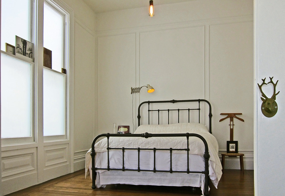 Bedroom - mid-sized eclectic medium tone wood floor bedroom idea in San Francisco with white walls and no fireplace