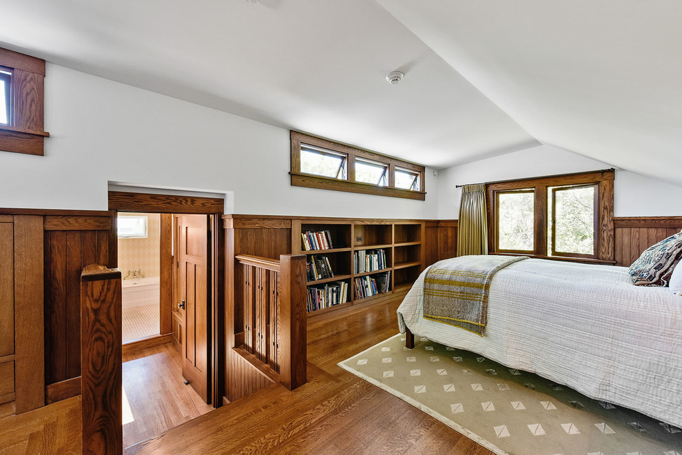 Example of a small arts and crafts guest medium tone wood floor bedroom design in San Francisco with multicolored walls