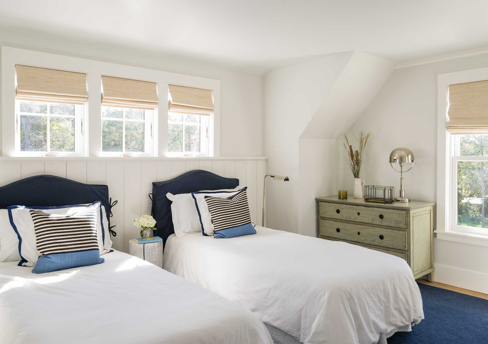Medium sized coastal guest bedroom in Boston with white walls, light hardwood flooring, no fireplace and brown floors.
