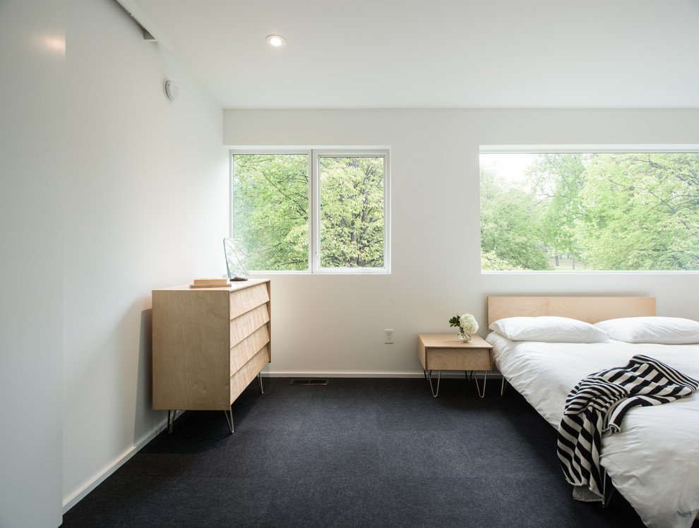 Idéer för ett modernt sovrum, med vita väggar och heltäckningsmatta