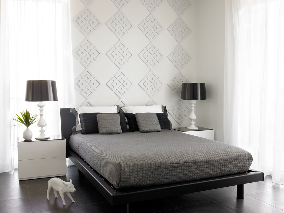 Inspiration for a large modern master bedroom remodel in Miami with white walls