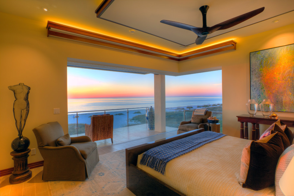 Example of a mid-sized minimalist master porcelain tile bedroom design in Tampa with beige walls and no fireplace