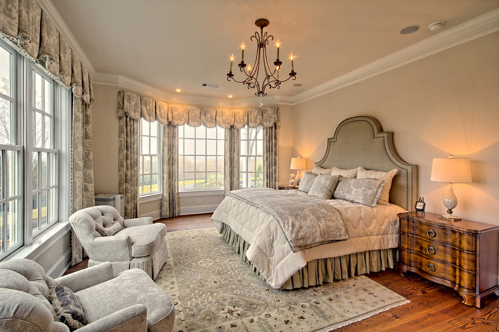 Design ideas for a medium sized traditional master and grey and brown bedroom in Atlanta with beige walls, dark hardwood flooring, no fireplace and brown floors.