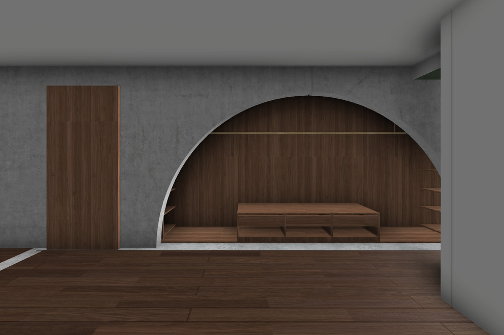 Inspiration pour une petite chambre parentale design avec un mur gris, un sol en bois brun et un sol marron.