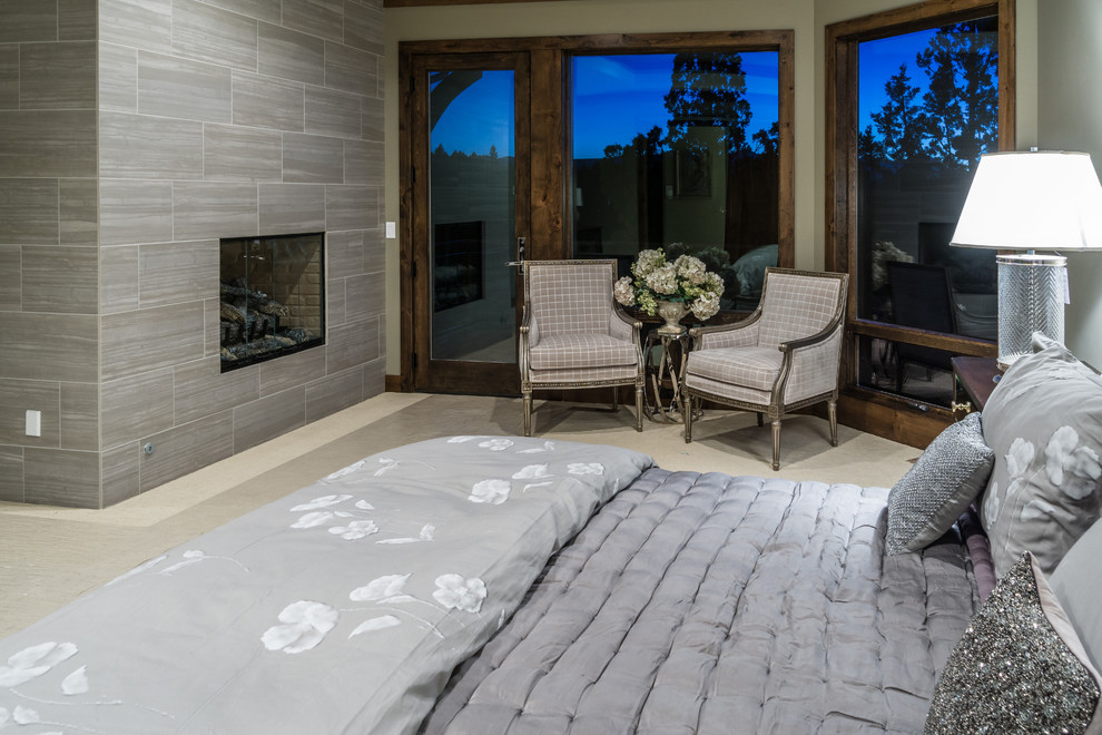 Example of a large master carpeted bedroom design in Other with a standard fireplace and a tile fireplace