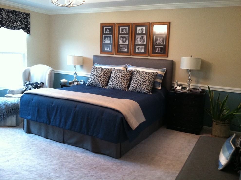 This is an example of a large traditional master bedroom in Cleveland with beige walls and carpet.