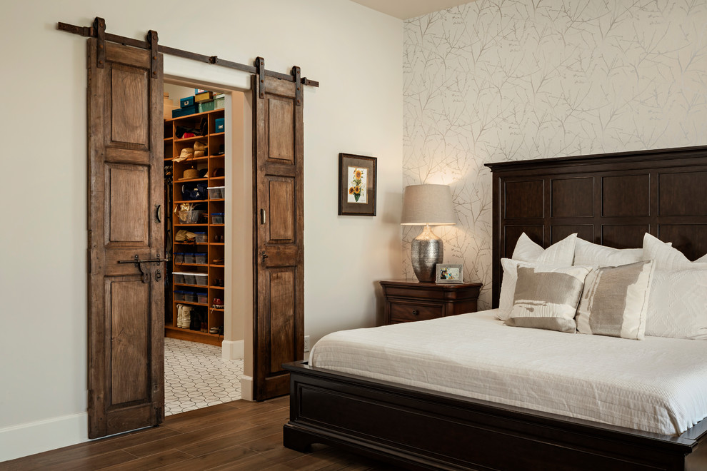 Photo of a medium sized master and grey and brown bedroom in Phoenix with beige walls, ceramic flooring, brown floors and feature lighting.