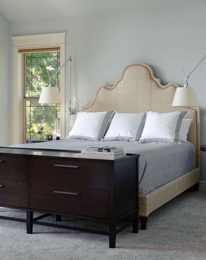 Example of a transitional master carpeted bedroom design in Seattle with blue walls
