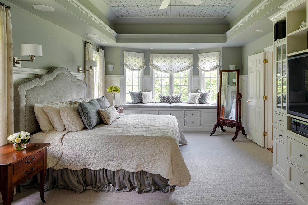 Design ideas for a medium sized traditional master bedroom in Boston with green walls and carpet.