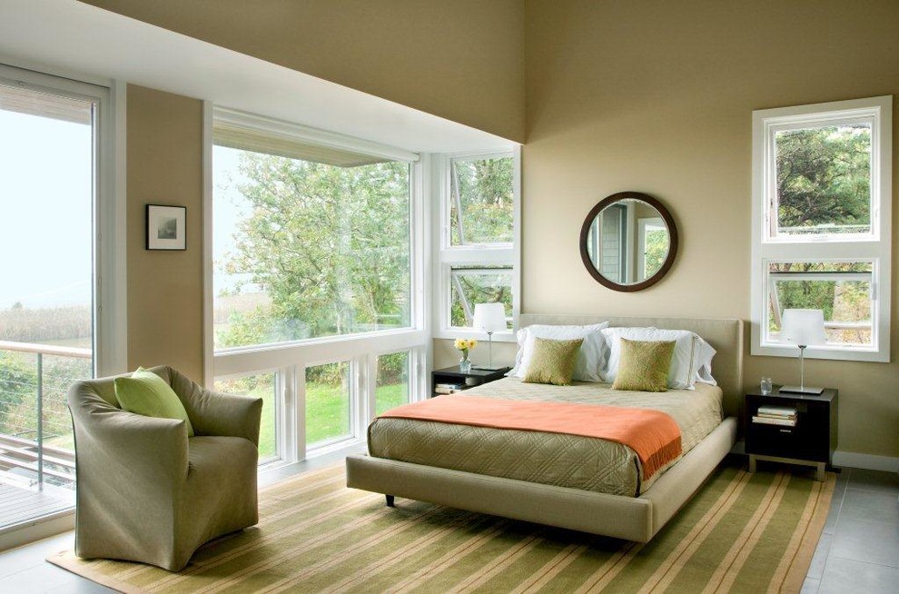 Example of a mid-sized trendy master porcelain tile bedroom design in Boston with green walls