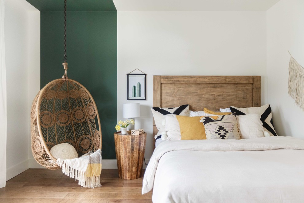 Inspiration for an eclectic light wood floor and beige floor bedroom remodel in Vancouver with multicolored walls