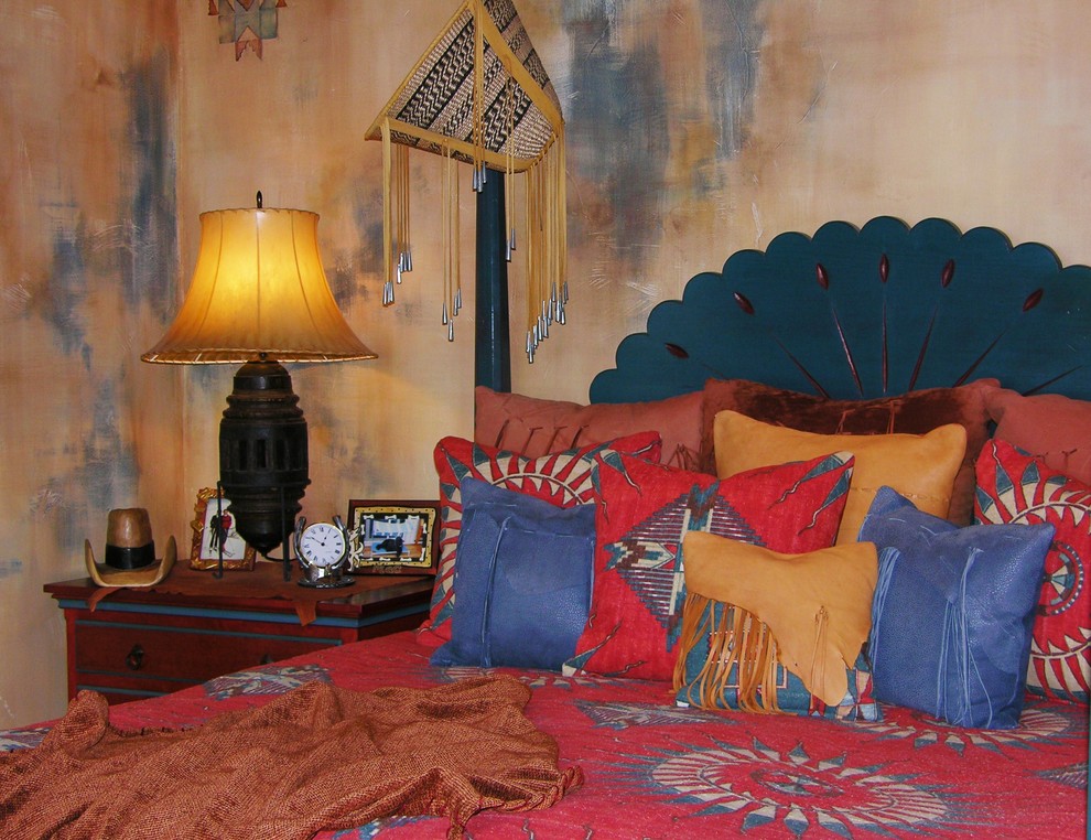 Rustic bedroom in Sacramento with blue walls and medium hardwood flooring.