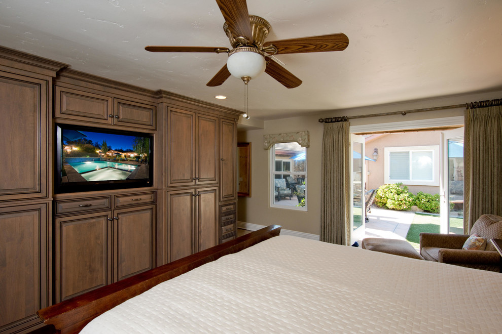 Photo of a medium sized modern master bedroom in Los Angeles with beige walls, dark hardwood flooring and no fireplace.