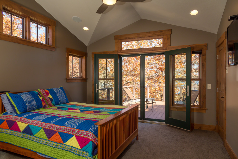 Example of a mid-sized mountain style master carpeted bedroom design in Minneapolis with gray walls and no fireplace