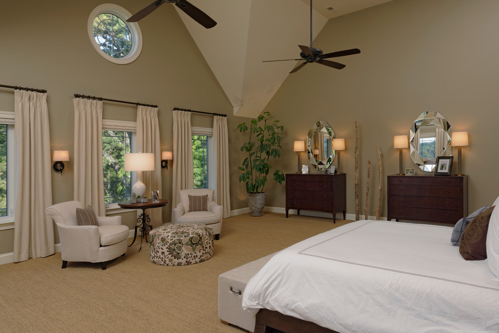 This is an example of a large classic master bedroom in DC Metro with beige walls and carpet.