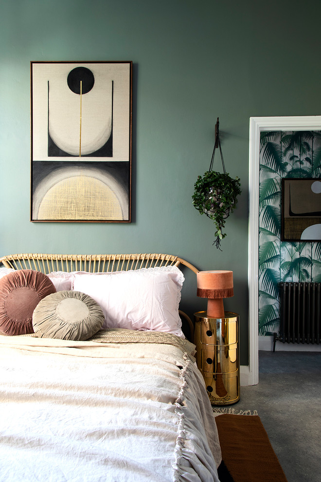 Design ideas for a contemporary grey and pink bedroom in London with green walls, carpet and grey floors.