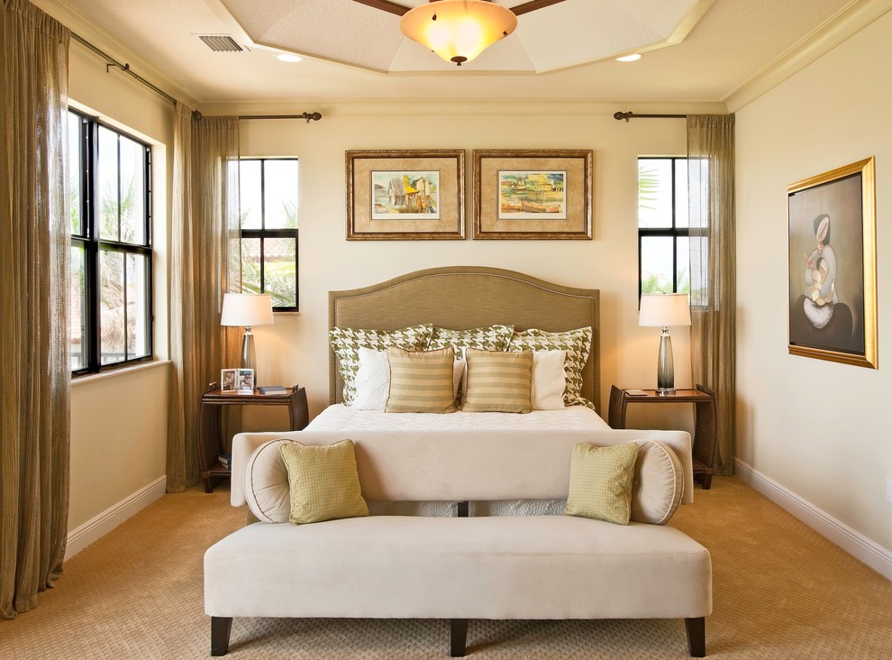 Example of a trendy master carpeted bedroom design in Miami with beige walls