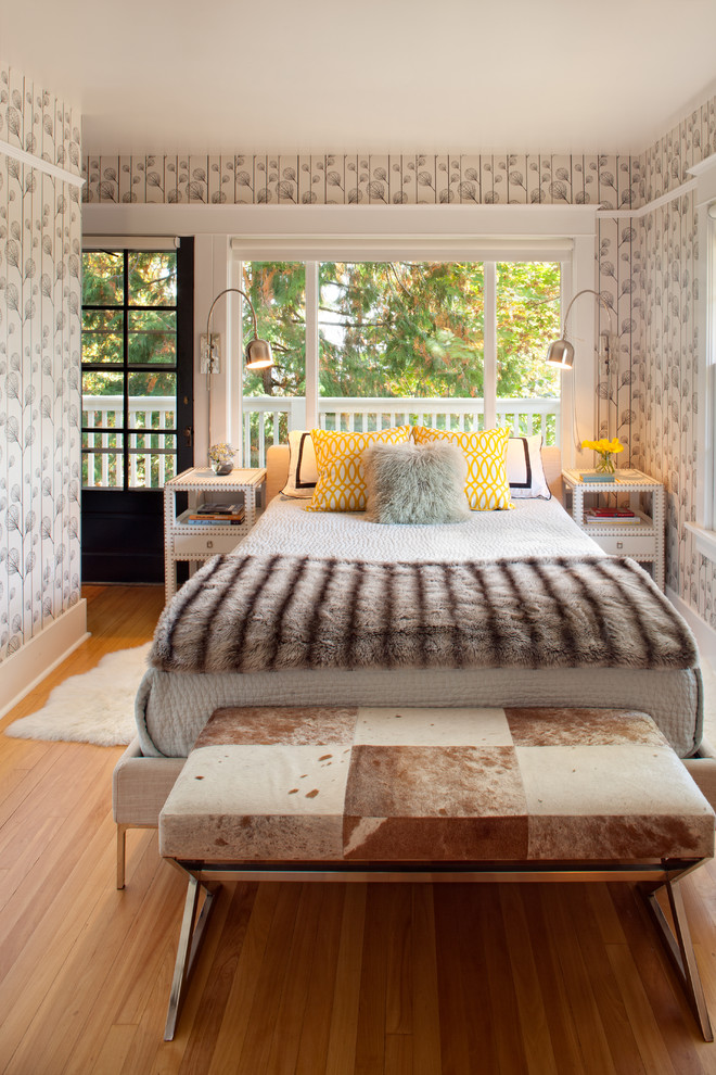 Inspiration for a bohemian bedroom in Portland with beige walls and medium hardwood flooring.