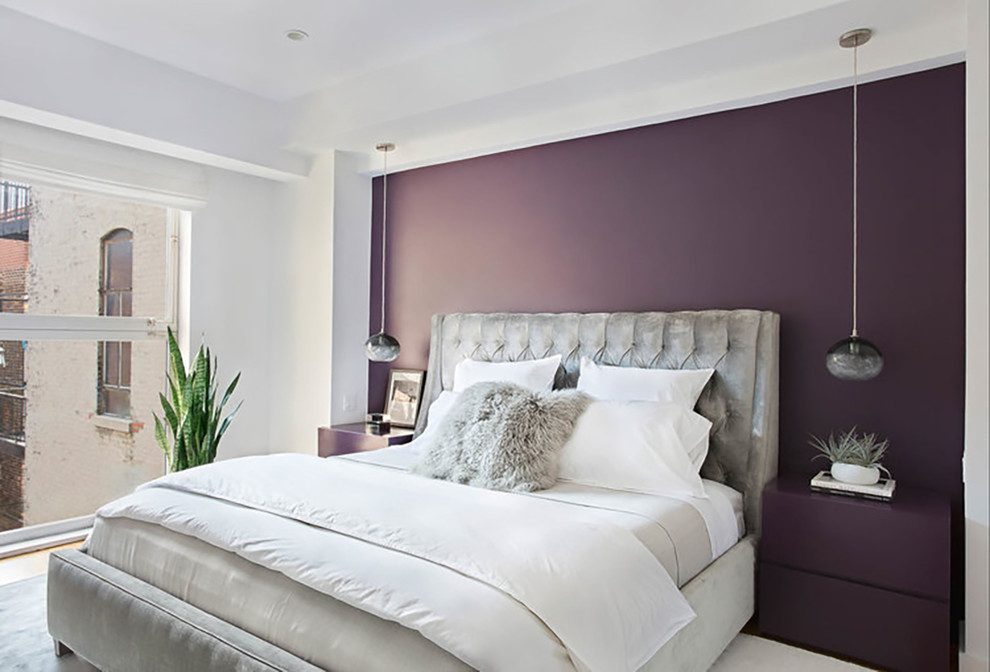 Example of a small trendy guest bedroom design in New York with purple walls