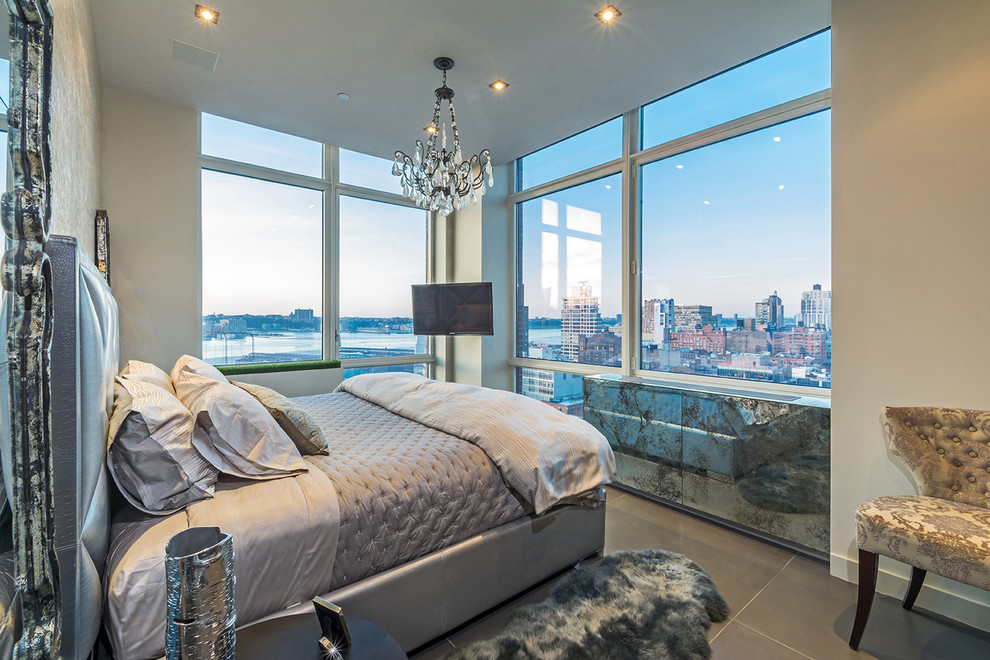 Bedroom - small contemporary master concrete floor bedroom idea in New York with beige walls