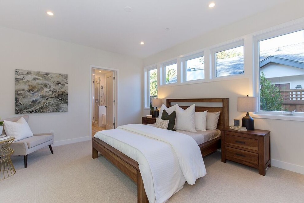 Inspiration for a mid-sized transitional master carpeted and beige floor bedroom remodel in San Francisco with beige walls and no fireplace