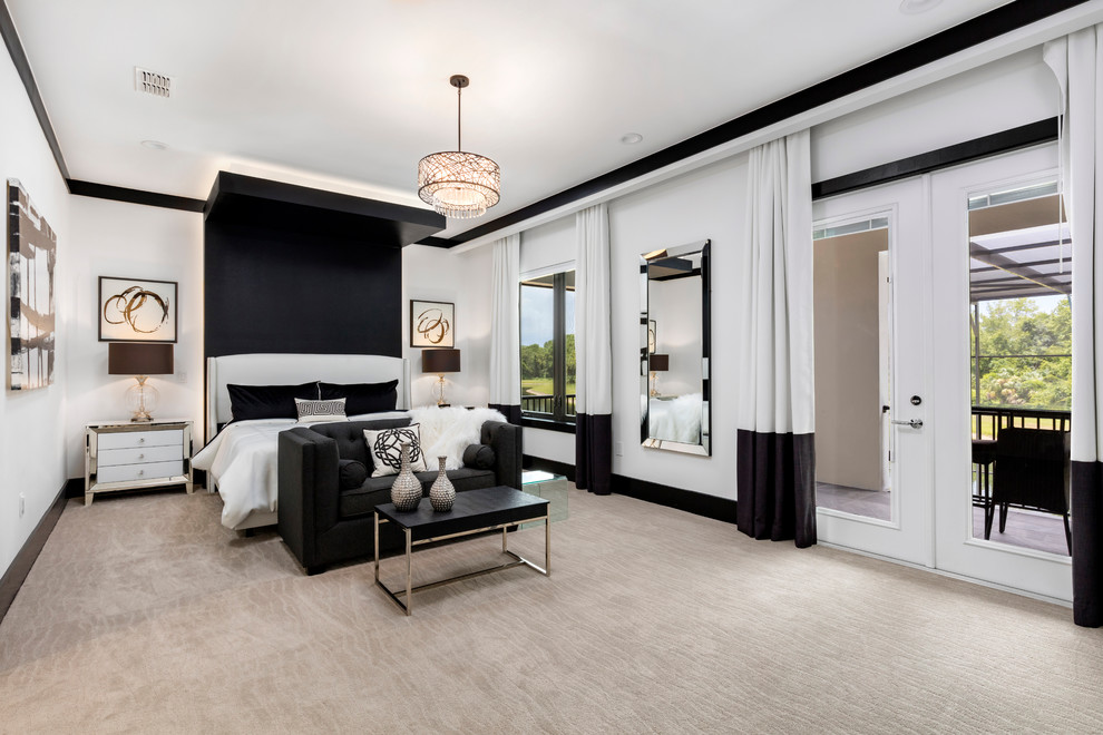 This is an example of a large modern master bedroom in Orlando with white walls, carpet and no fireplace.