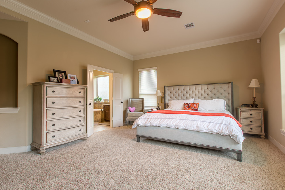 Example of a large classic master carpeted and beige floor bedroom design in Houston with beige walls and no fireplace