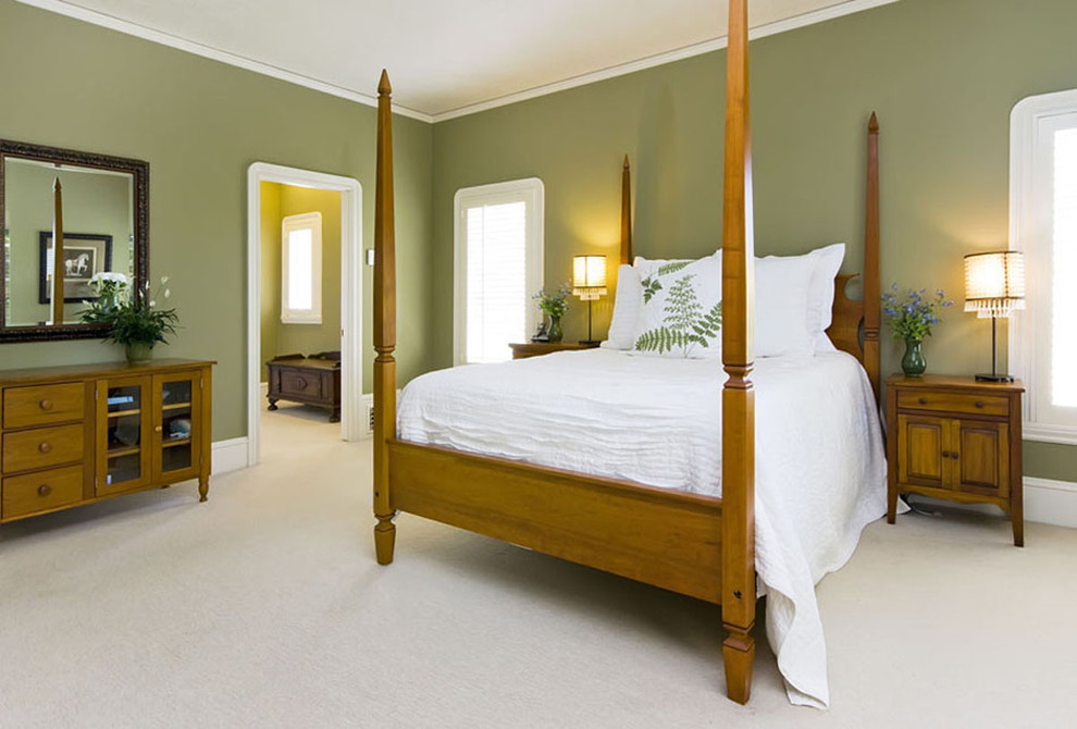 Inspiration for a tropical bedroom remodel in San Francisco with green walls
