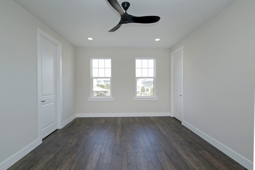 Bedroom - mid-sized traditional master vinyl floor and brown floor bedroom idea in Orlando with gray walls