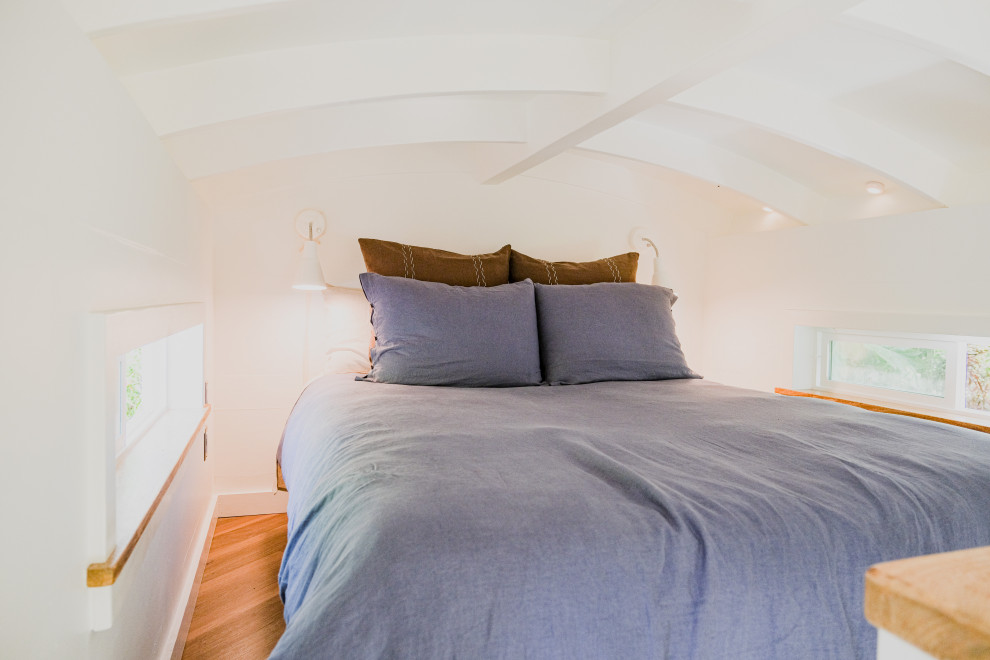 Example of a small trendy vinyl floor bedroom design in Hawaii with white walls