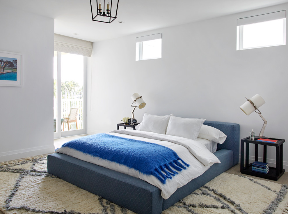 Inspiration for a nautical bedroom in Miami with white walls and beige floors.
