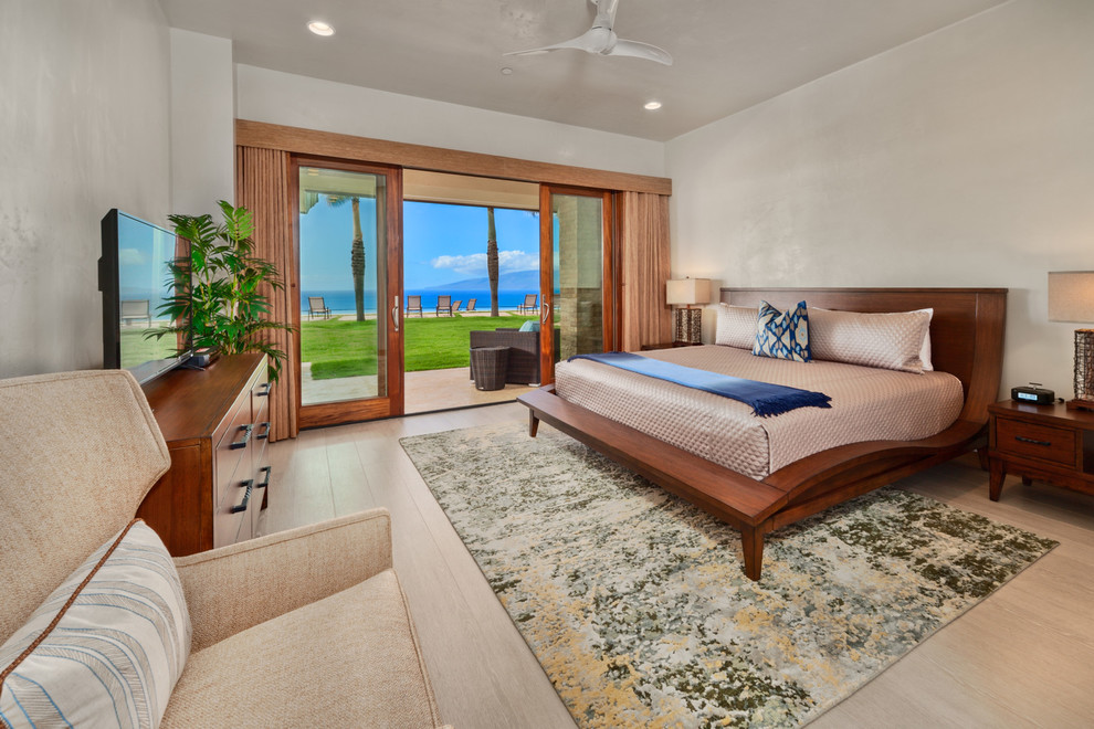 Large trendy guest light wood floor and beige floor bedroom photo in Hawaii with white walls and no fireplace