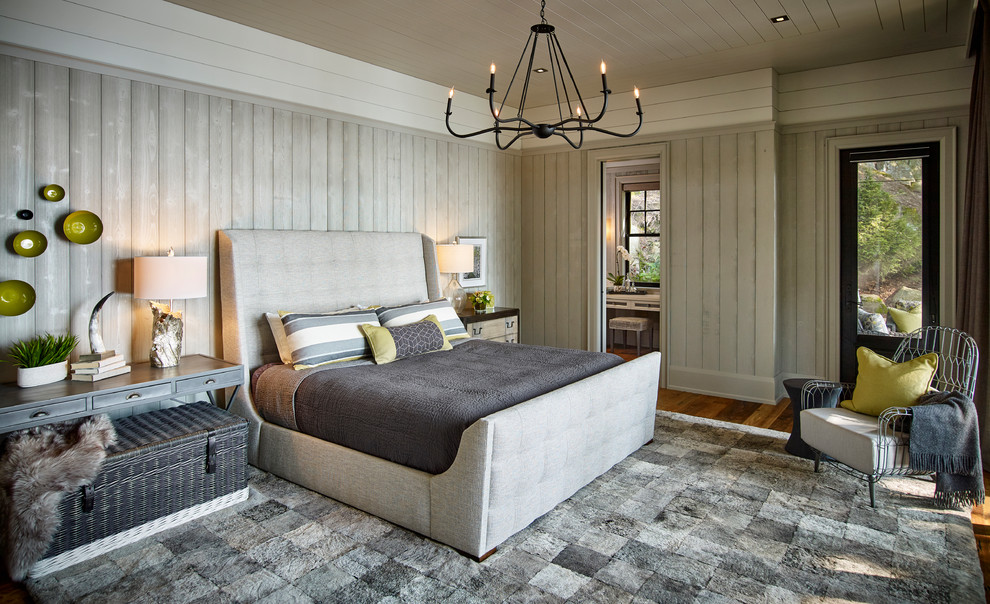 Farmhouse master medium tone wood floor and brown floor bedroom photo in Toronto with gray walls