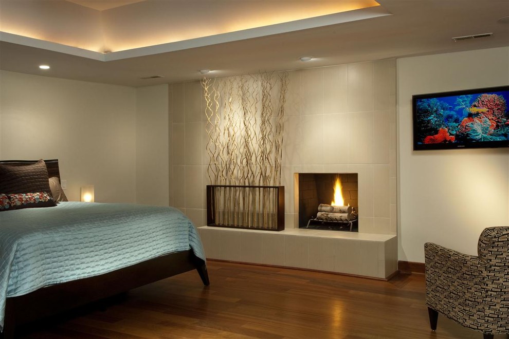 Bedroom - contemporary bedroom idea in Other with a tile fireplace and a standard fireplace