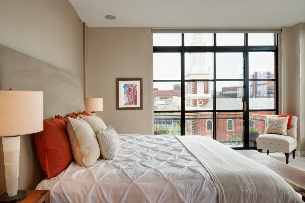 Photo of a large modern master bedroom in Philadelphia with beige walls, carpet and beige floors.
