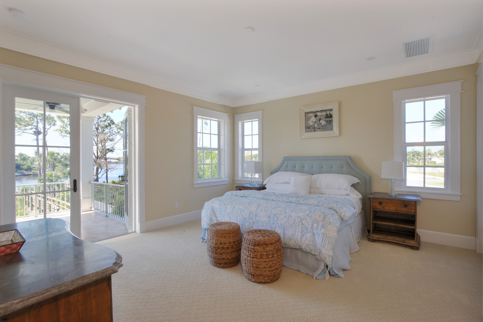 Design ideas for a large nautical master bedroom in Miami with beige walls and carpet.