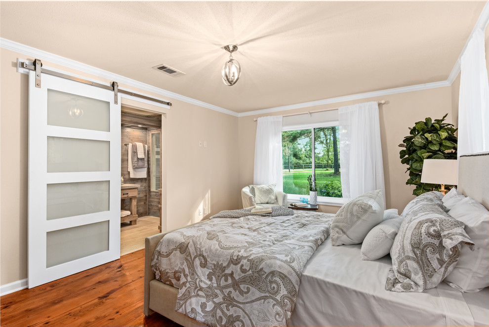 This is an example of a farmhouse bedroom in Houston.