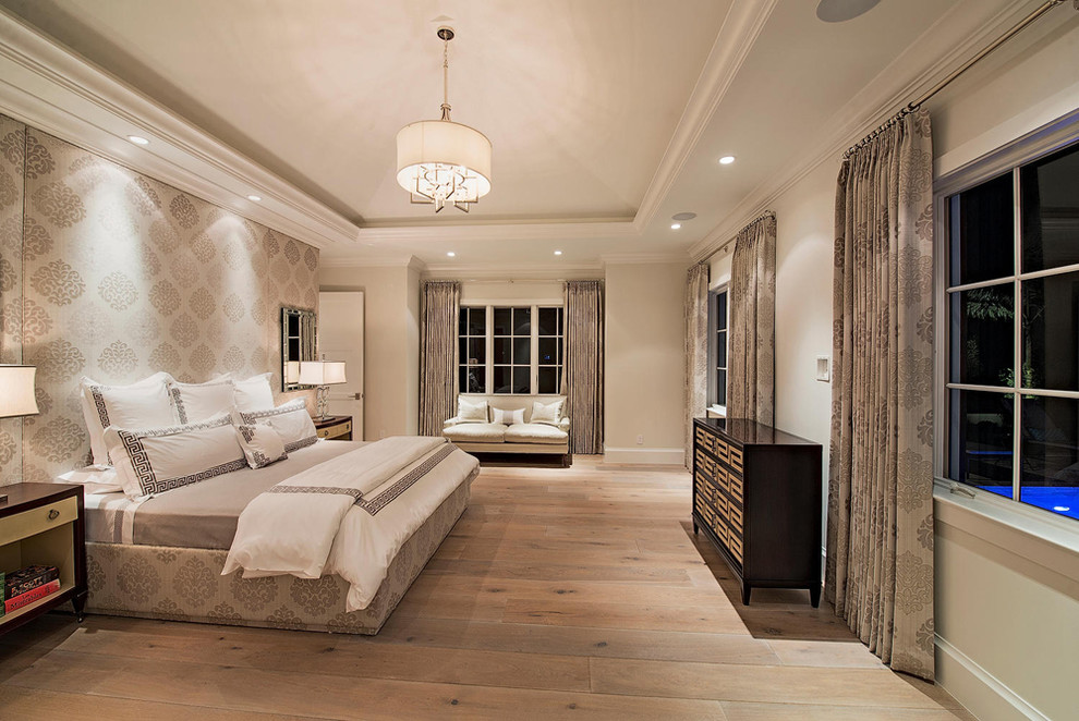 Design ideas for a contemporary master bedroom in Miami with beige walls, light hardwood flooring and no fireplace.