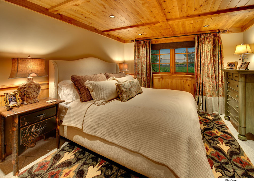 This is an example of a rustic guest bedroom in Sacramento with beige walls.